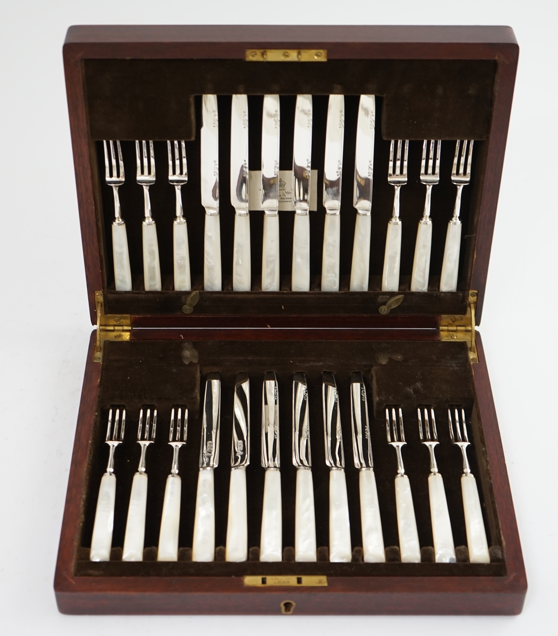 A cased set of twelve pairs of George VI mother of pearl handled silver dessert eaters, by Mappin & Webb